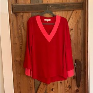 Pink trimmed red flowing top